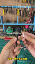 Load and play video in Gallery viewer, Hands holding an aluminum arrow insert adapter next to a fiberglass arrow shaft in a workshop setting.